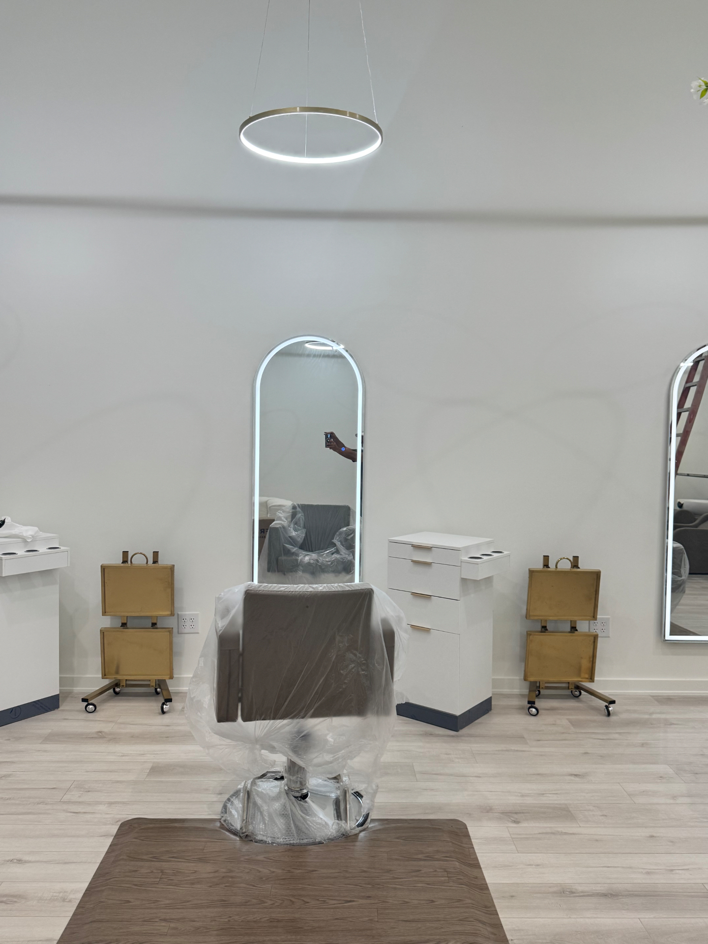 Finished styling station with illuminated arched mirror at Ivory Blossom Salon